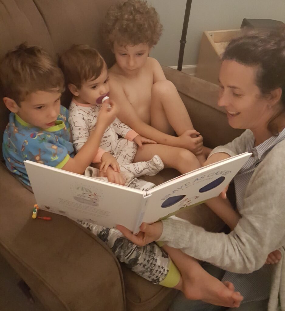 Alynn Pessotto from Living Literacy provides literacy tutoring to help spark the joy of reading among chidren and young teens in Calgary Alberta_Alynn reading to Jack Liam and C